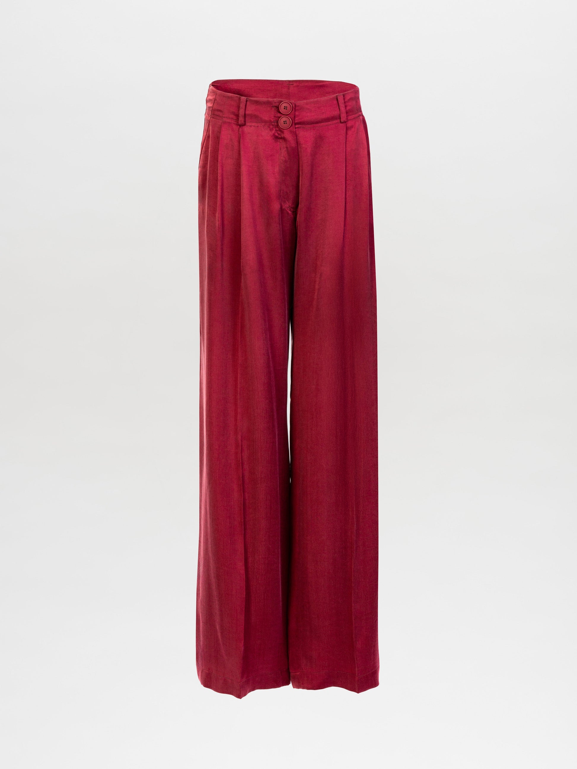The Opal Pant is a high-waisted, wide-leg red trouser made from premium Italian fabric with front pleats, belt loops, and a double-button closure, shown on a plain white background.