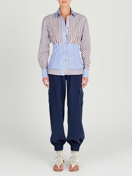A pair of Jess Pant Navy with an elastic waistband and pockets.